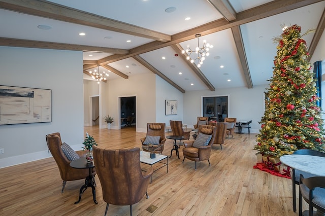 living room with beam ceiling, a chandelier, high vaulted ceiling, and light hardwood / wood-style floors