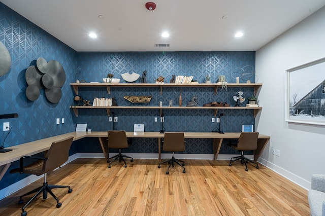 office featuring light wood-type flooring and built in desk