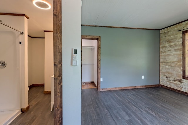 interior space featuring hardwood / wood-style flooring and crown molding