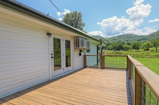 wooden deck featuring french doors and a yard