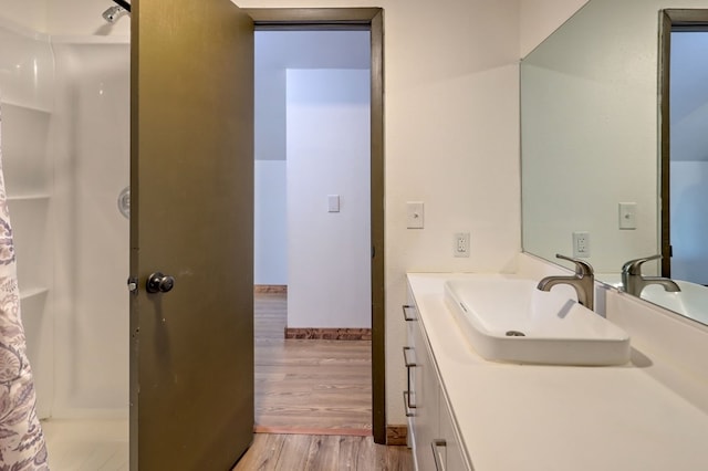 bathroom with wood-type flooring and vanity