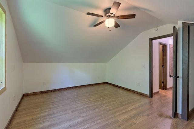 bonus room with vaulted ceiling, hardwood / wood-style floors, and ceiling fan