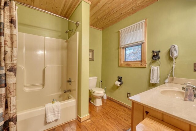 full bathroom featuring wood ceiling, toilet, vanity, hardwood / wood-style flooring, and shower / bathtub combination with curtain