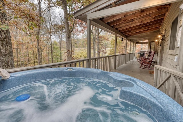 deck featuring a hot tub