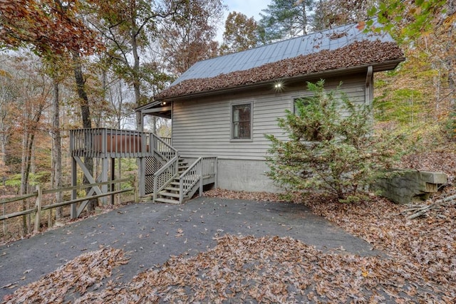 view of side of home with a wooden deck