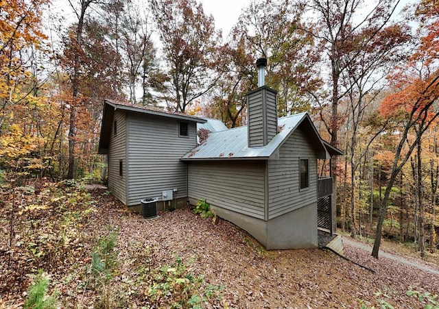 view of home's exterior with cooling unit