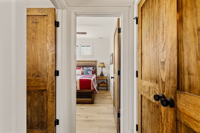 hall with light wood-style flooring