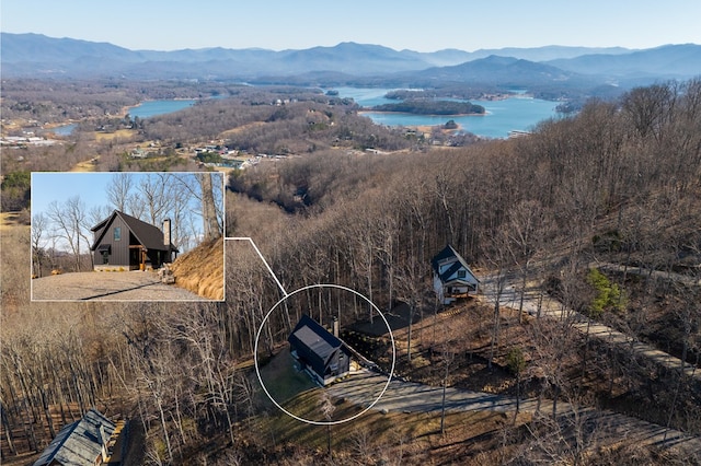 aerial view featuring a water and mountain view