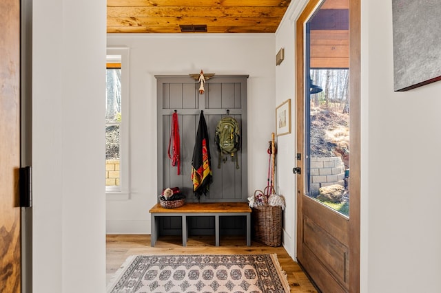 mudroom featuring wooden ceiling, visible vents, and wood finished floors