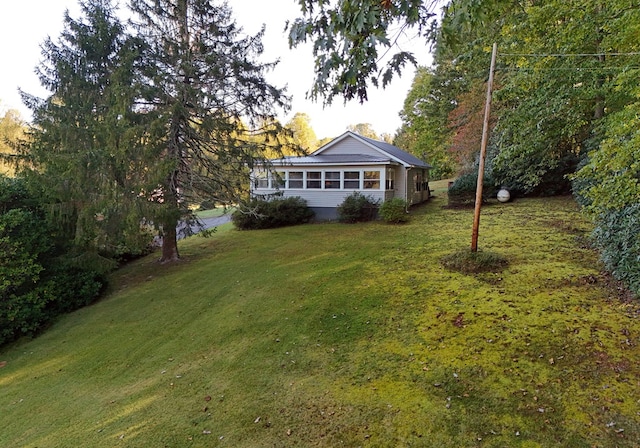 view of yard featuring a sunroom