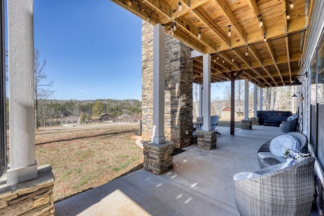 view of patio / terrace featuring a hot tub