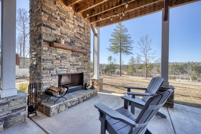 view of patio / terrace with an outdoor stone fireplace