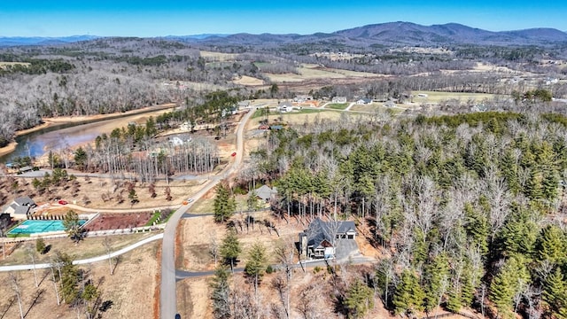 birds eye view of property with a mountain view