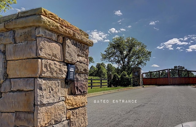 view of gate with fence