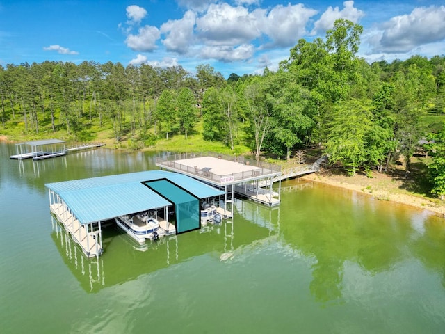 view of dock featuring a water view and a wooded view