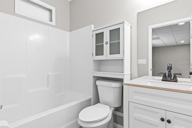 full bathroom with vanity, shower / bathtub combination, and toilet