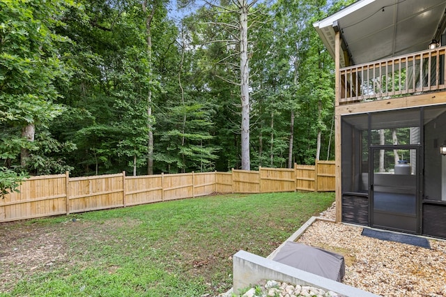 view of yard with a sunroom