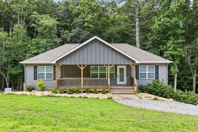 view of front of house featuring a front yard and a porch