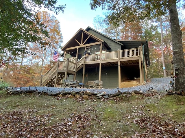 rear view of property with a deck