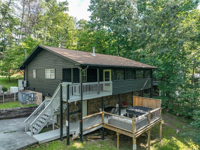 back of house with a patio area and a deck