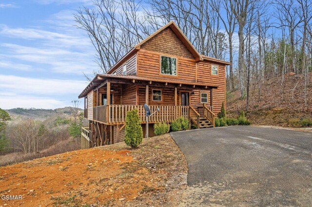 log home with covered porch