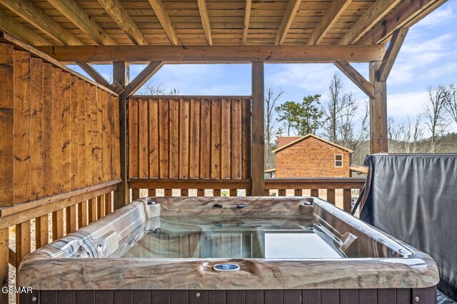 deck featuring a hot tub