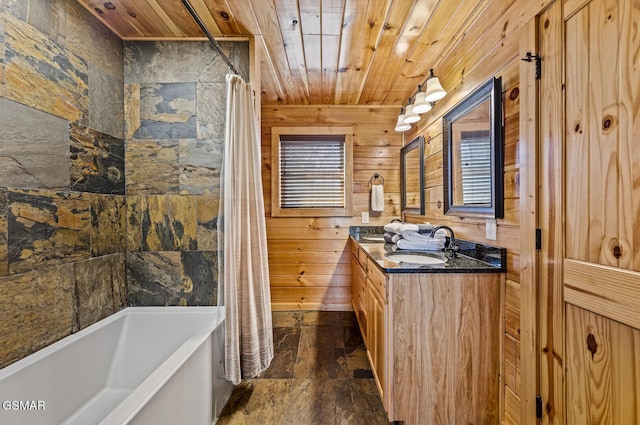 bathroom with vanity, shower / bathtub combination with curtain, wood ceiling, and wood walls