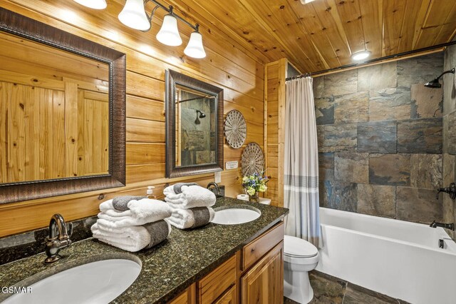 full bathroom with wooden ceiling, wood walls, toilet, shower / tub combo with curtain, and vanity