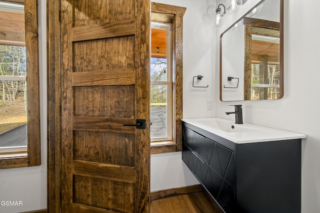 bathroom featuring vanity and wood finished floors