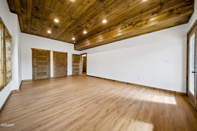 spare room with light wood-style flooring, recessed lighting, wood ceiling, and baseboards