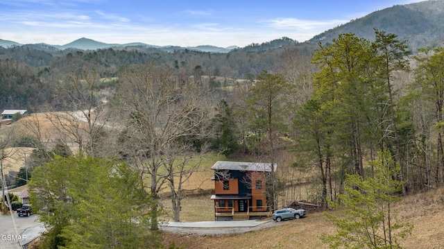 exterior space featuring a view of trees