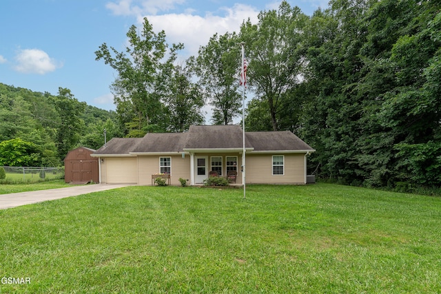 534 Shellbark Rd, Newport, TN 37821 - view of front facade with driveway, an attached garage, and a storage unit