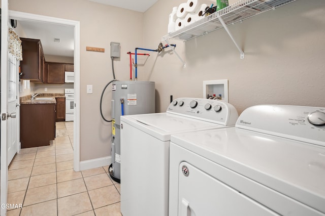 534 Shellbark Rd, Newport, TN 37821 - laundry area featuring water heater, washing machine and clothes dryer, and light tile patterned flooring
