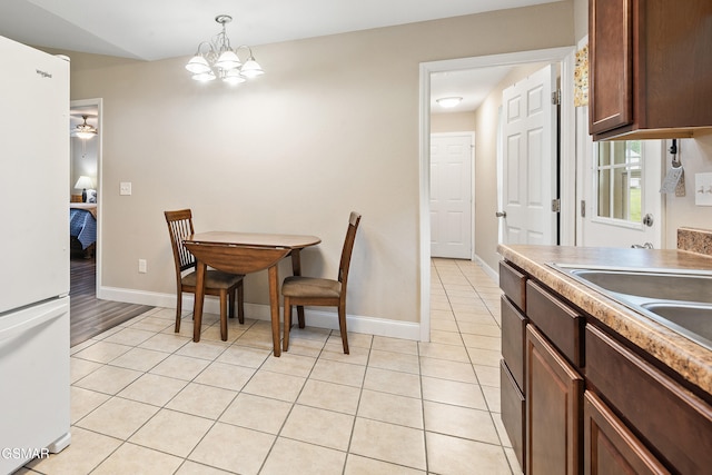 534 Shellbark Rd, Newport, TN 37821 - dining space with light tile patterned flooring and a chandelier