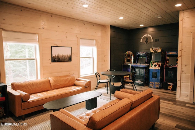 living room featuring wood ceiling, wood-type flooring, and wooden walls