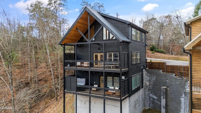 back of house with a balcony