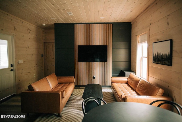 living room featuring wooden walls and wooden ceiling