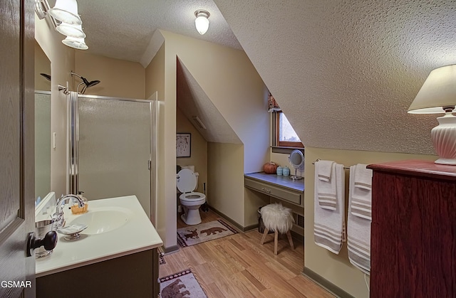 2846 Mountain View Cir, Sevierville, TN 37862 - full bath featuring a textured ceiling, wood finished floors, a stall shower, and vanity