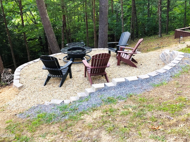 2846 Mountain View Cir, Sevierville, TN 37862 - view of yard featuring an outdoor fire pit and a wooded view
