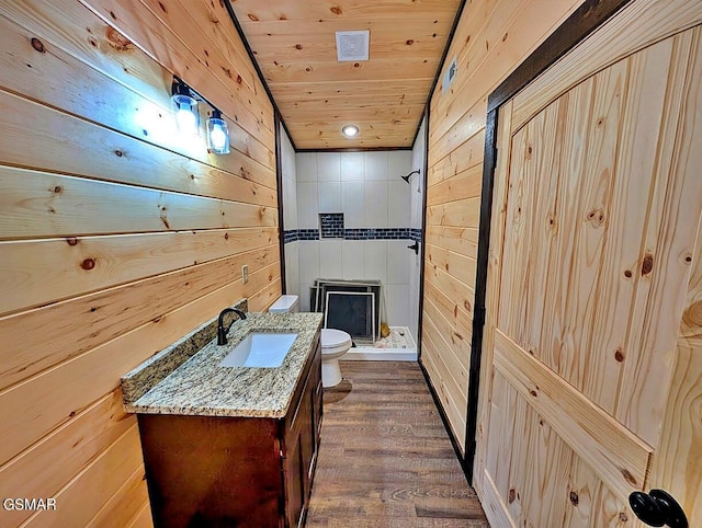 bathroom with wood walls, hardwood / wood-style flooring, toilet, walk in shower, and wood ceiling