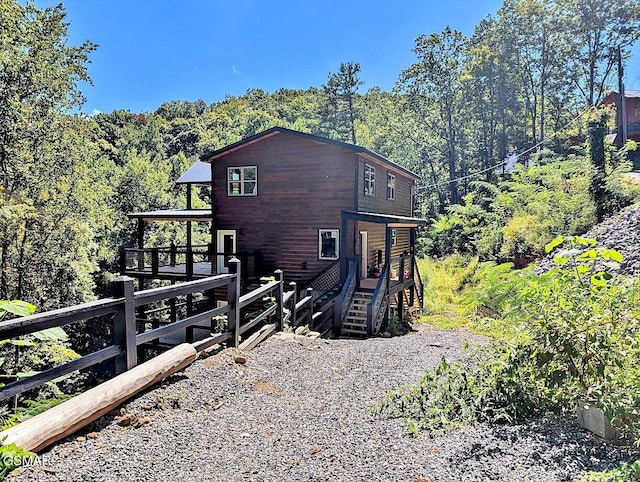 view of side of home featuring a deck