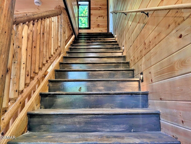 stairway with wooden walls