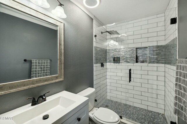 bathroom with vanity, toilet, and walk in shower