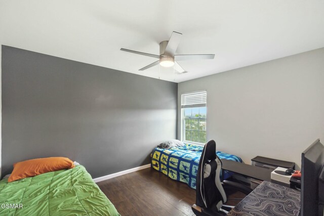 bedroom featuring ceiling fan and dark hardwood / wood-style floors