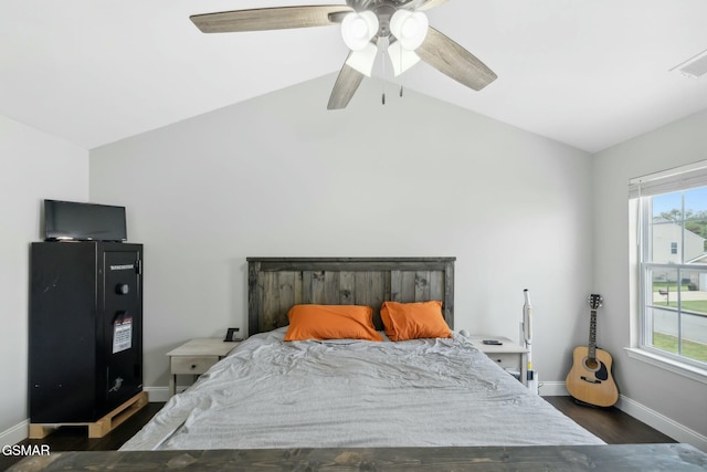 bedroom featuring multiple windows, ceiling fan, and lofted ceiling