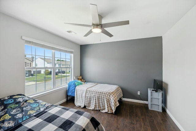 bedroom featuring dark hardwood / wood-style flooring and ceiling fan