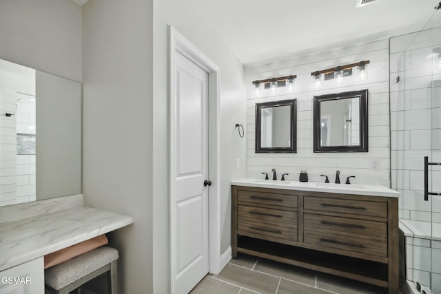 bathroom featuring vanity and an enclosed shower