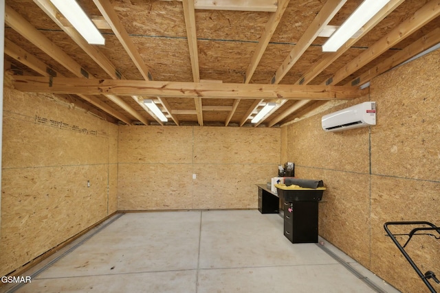 basement featuring a wall mounted AC