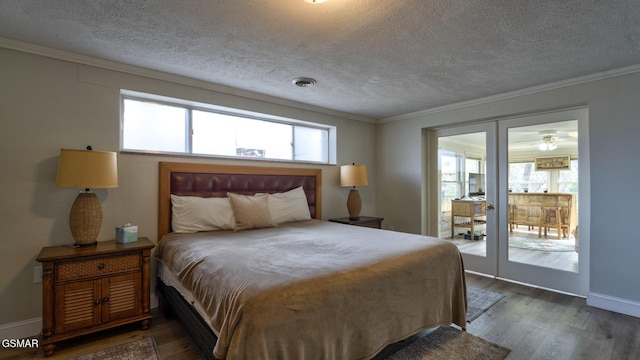 bedroom featuring dark wood finished floors, multiple windows, baseboards, and ornamental molding