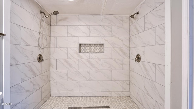 full bathroom with tiled shower